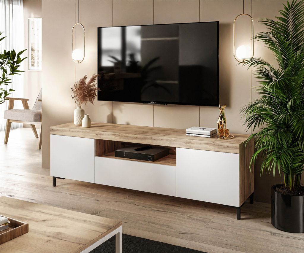 A modern living room with a TV stand and a large television.