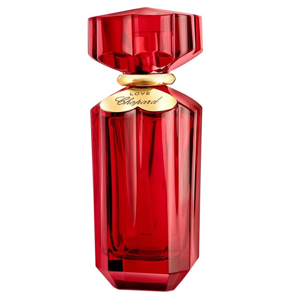A red perfume bottle with a gold accent and label.