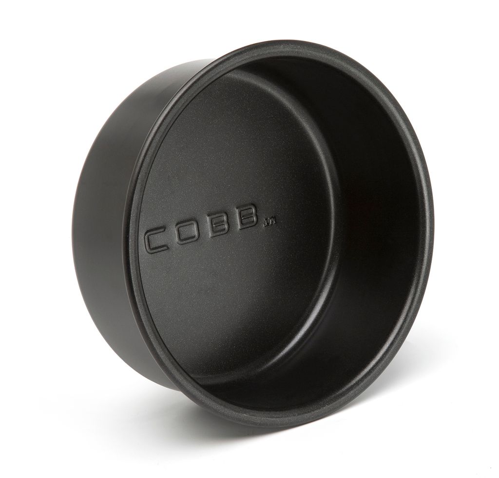 A black baking pan with the brand name embossed on the inside.