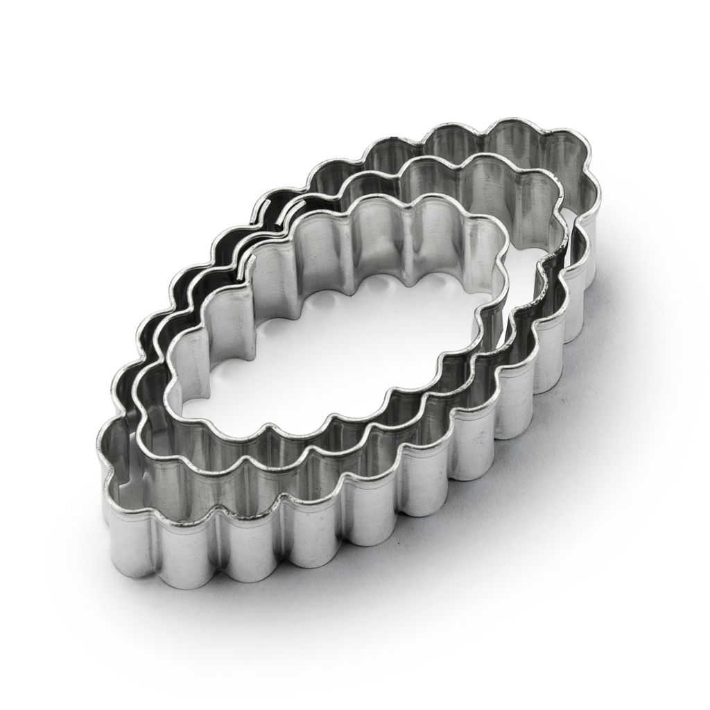 Two oval-shaped cookie cutters with scalloped edges are nested together on a white background.