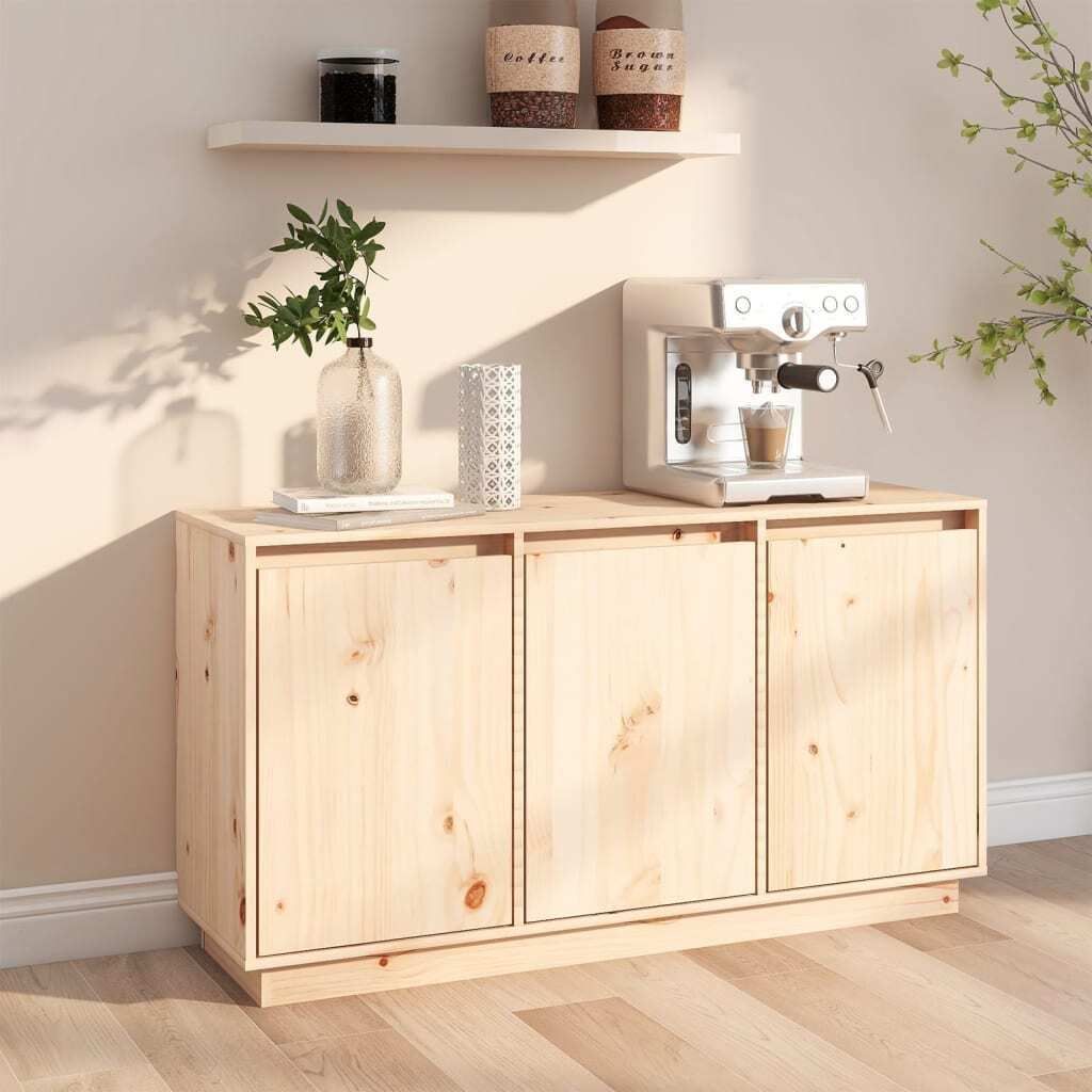 A light wood cabinet with three doors, topped with a coffee machine, a vase with greenery, and a decorative item.