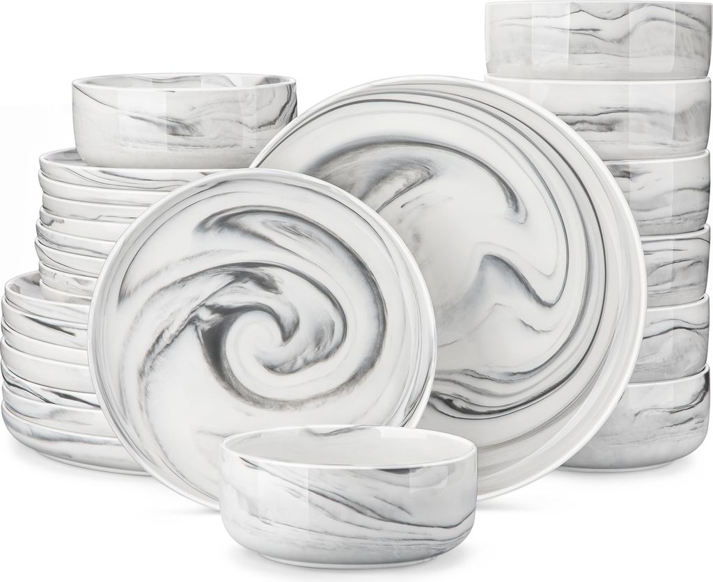 A stack of dinnerware with a marble-like pattern.