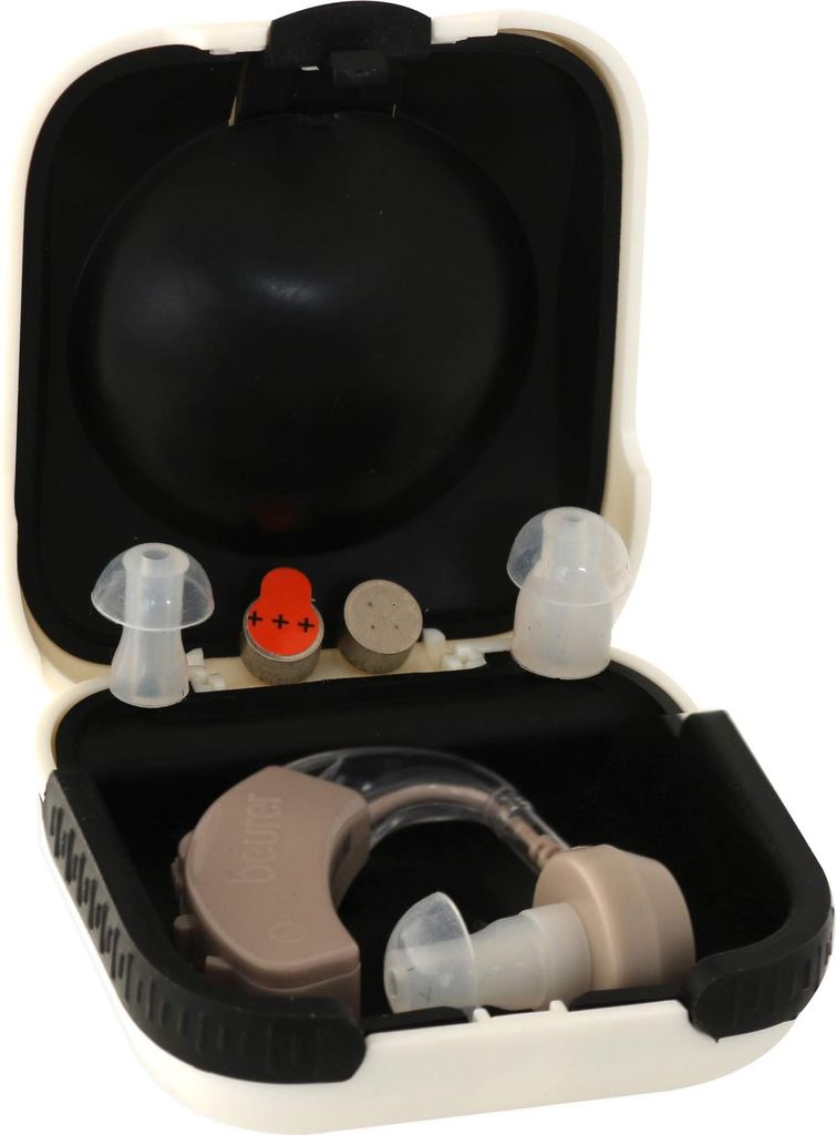An open case containing a hearing aid and accessories.