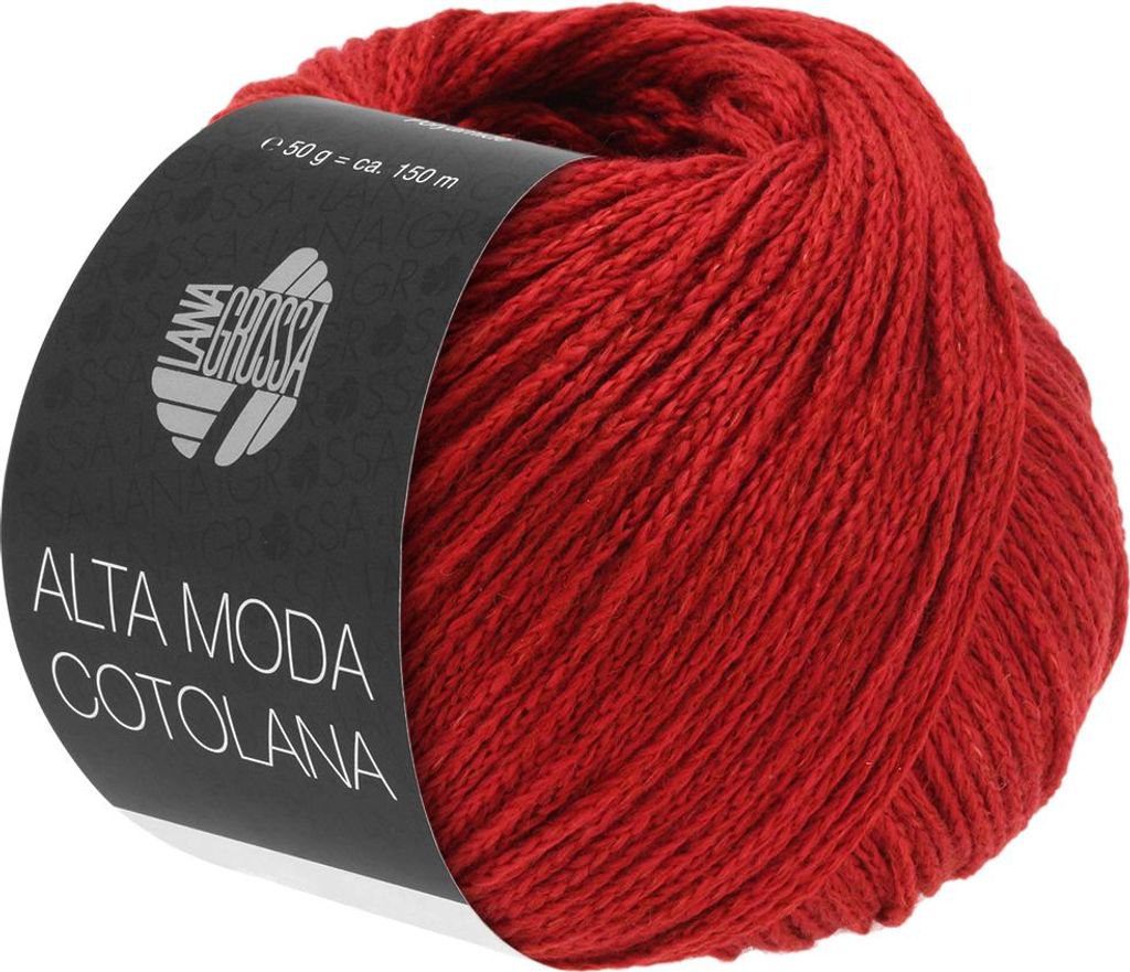 A ball of red yarn with a black label wrapped around it.