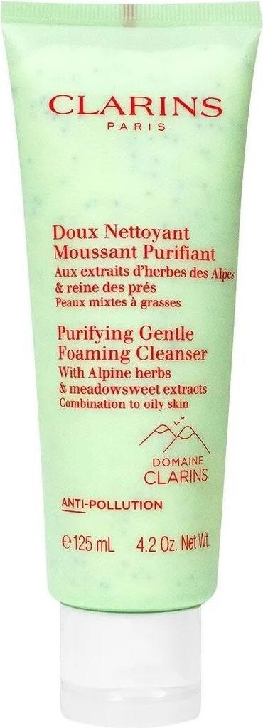 A product shot of a green tube of Clarins cleanser against a white background.