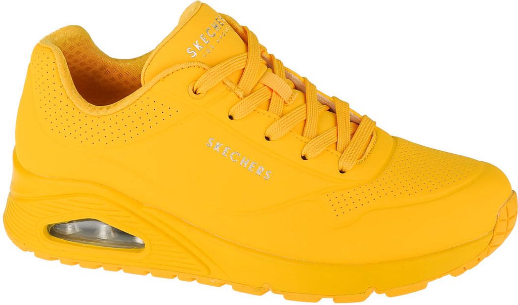A single yellow Skechers sneaker is shown from the side against a white background.
