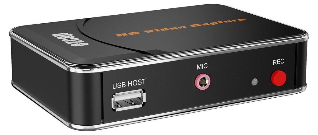 A black video capture device with silver trim is shown from a diagonal front-left angle against a black background.