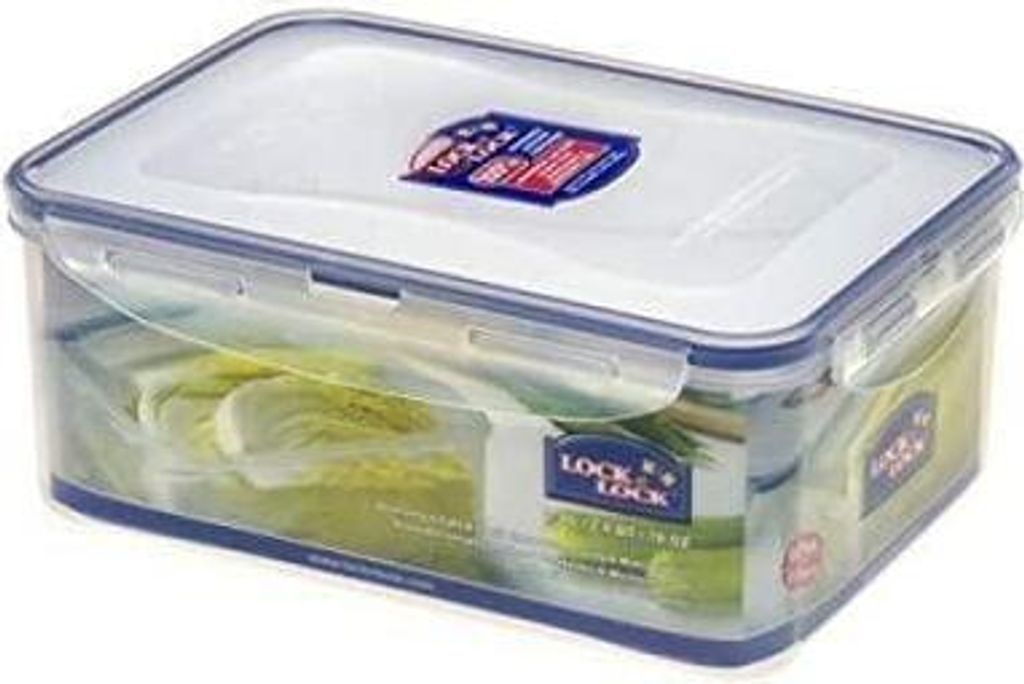 A clear plastic food storage container with a blue lid and white seal, filled with lettuce.