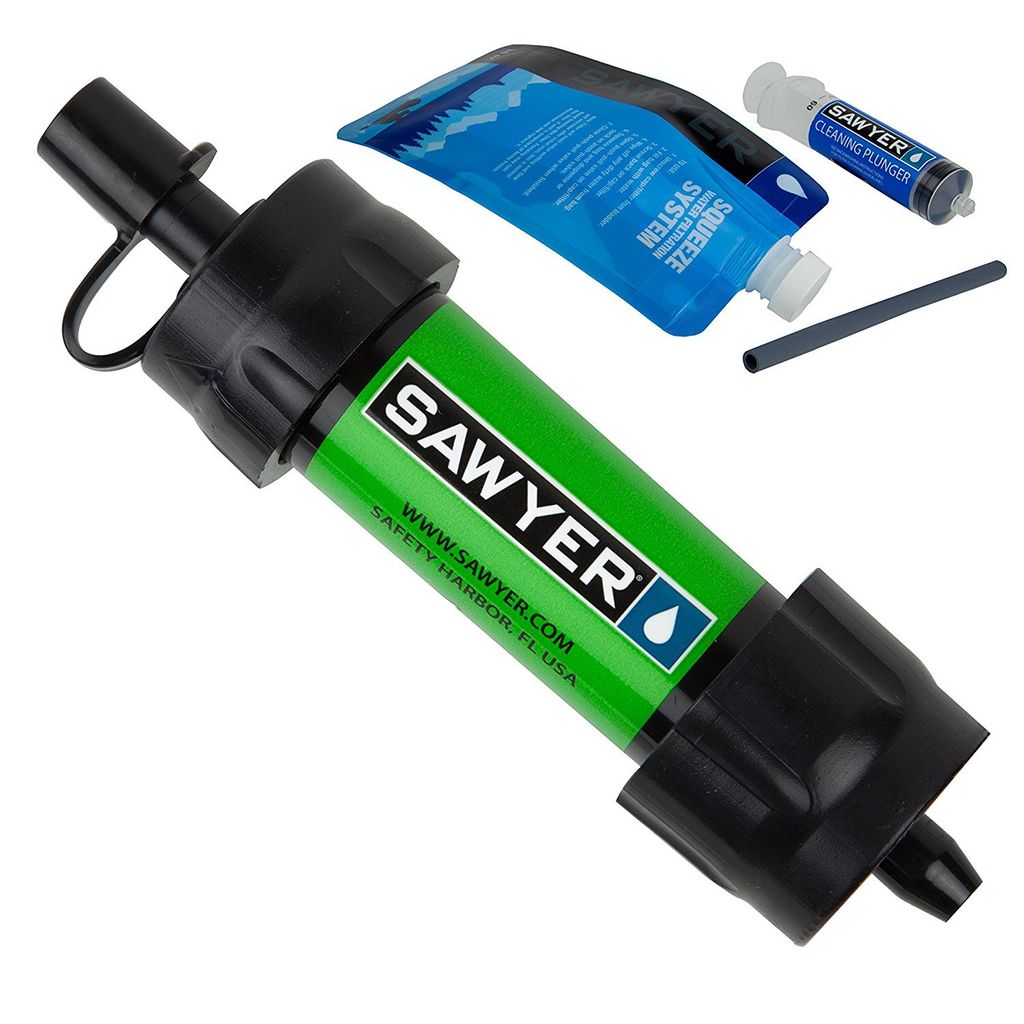 A Sawyer Mini water filter kit is displayed against a white background. The kit includes the filter, a squeeze pouch, a cleaning plunger, and a straw.