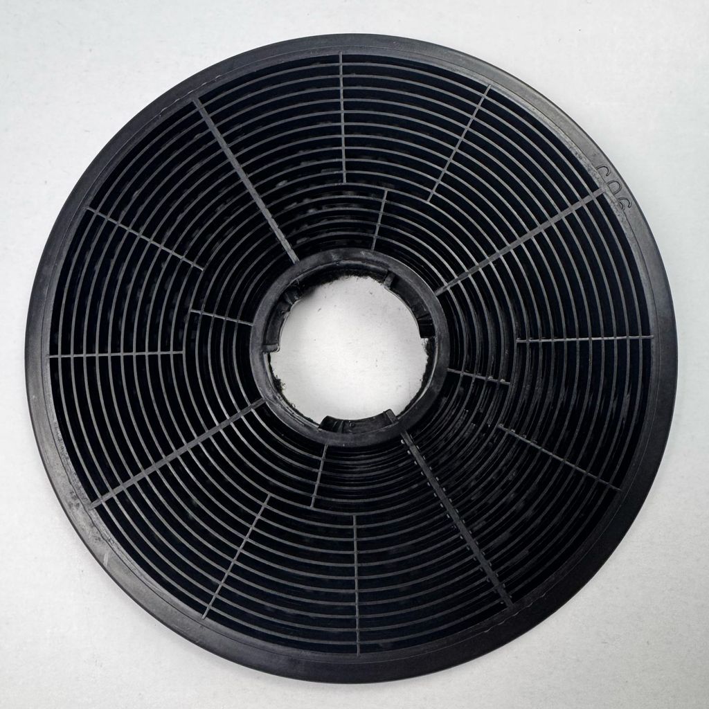 A black carbon filter is shown on a white background.