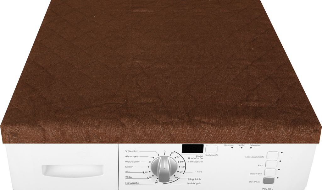 A brown cover is placed on top of a white washing machine.