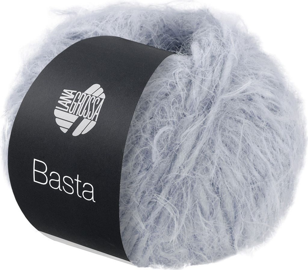 A ball of fluffy yarn with a black label wrapped around it.