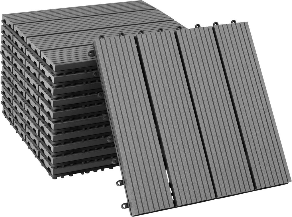 A stack of grey interlocking deck tiles with a few tiles laid out in front.