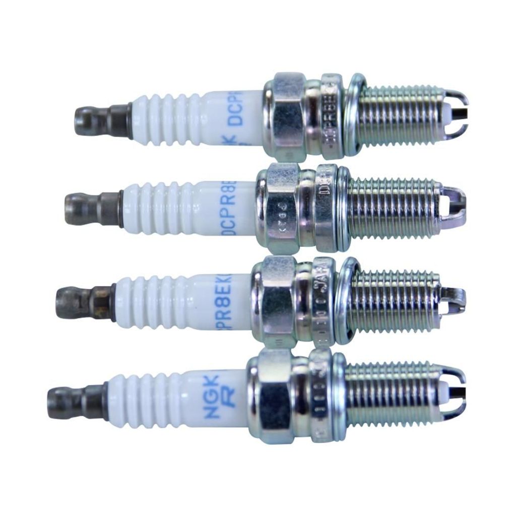 Four spark plugs are laid out horizontally against a white background.