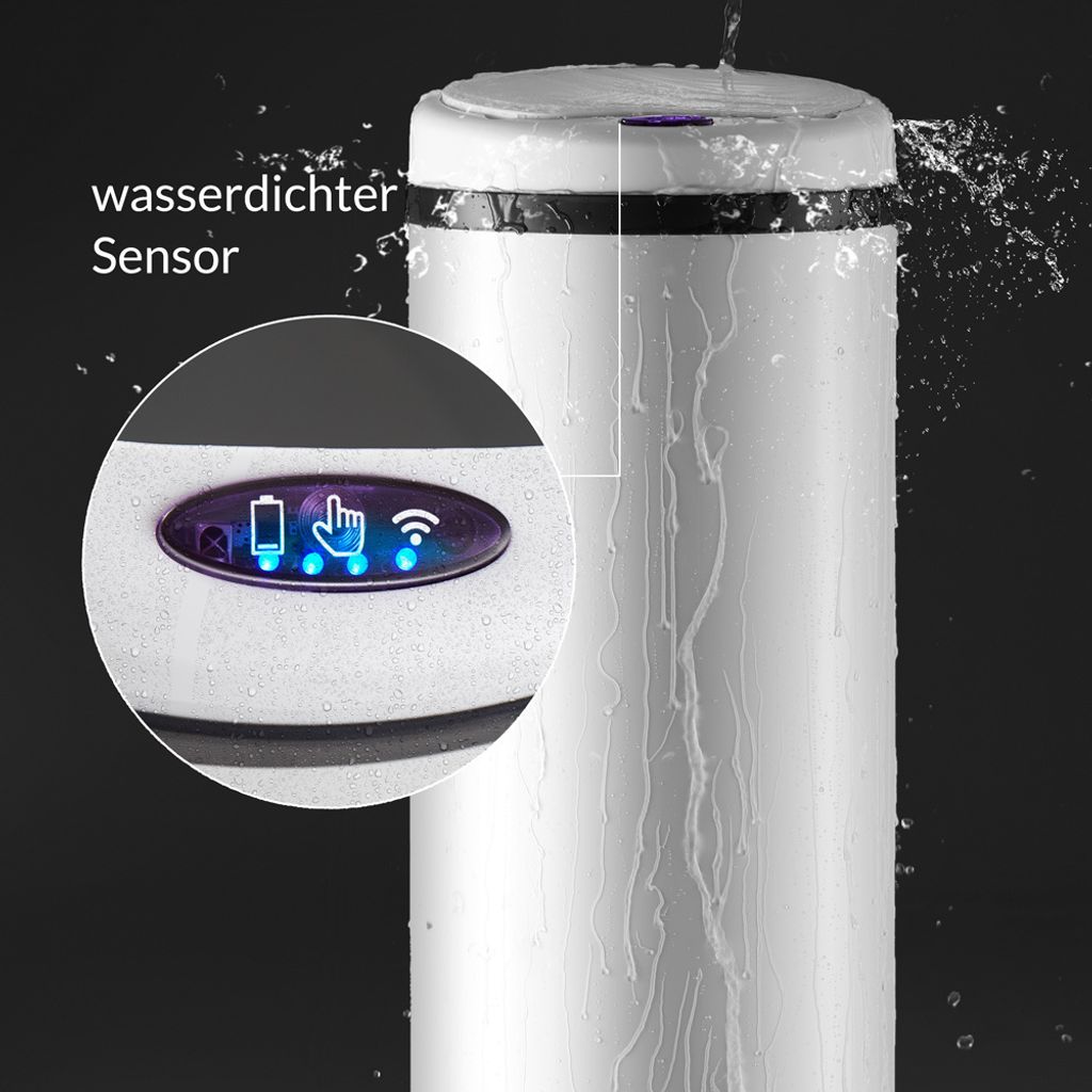 A close-up of a white sensor trash can with water splashing on it, highlighting its waterproof sensor and indicator lights.