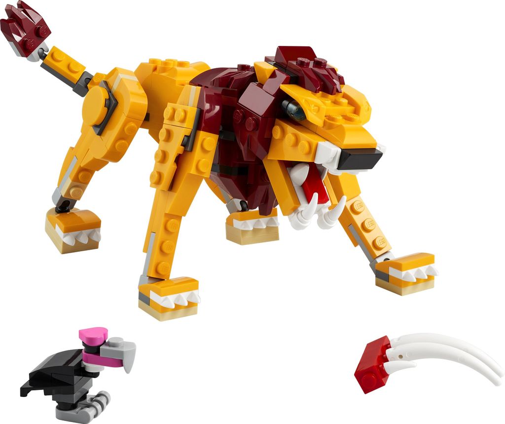 A LEGO Creator 3-in-1 set featuring a lion, a bird, and some accessories, displayed on a white background.