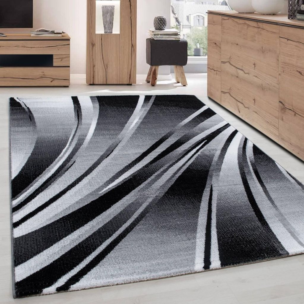 Moderner Teppich mit abstraktem, geschwungenem Muster in Schwarz und Grau, ideal für Wohnzimmer, Schlafzimmer und Esszimmer. 80 x 150 cm