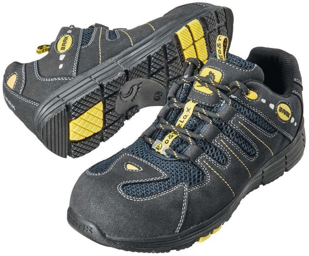A pair of black and yellow safety shoes are displayed against a white background.