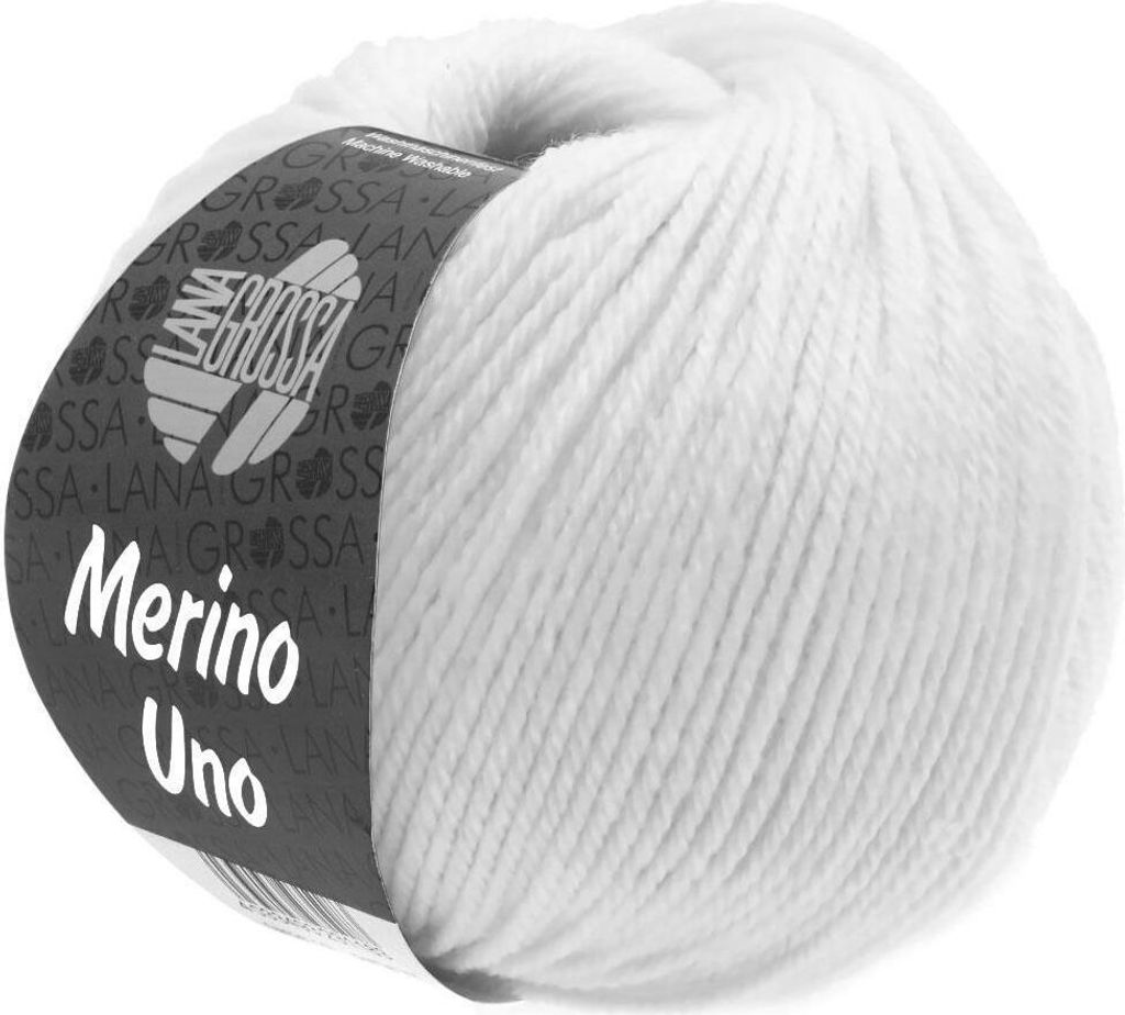 A ball of white merino wool yarn with a label.