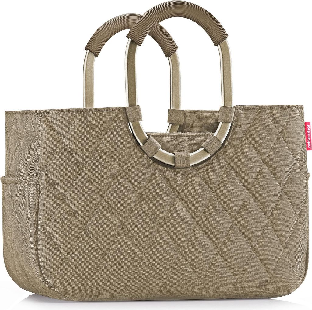 A studio shot of a quilted tote bag with metal handles.