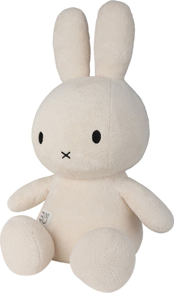 A stuffed toy rabbit sitting down.