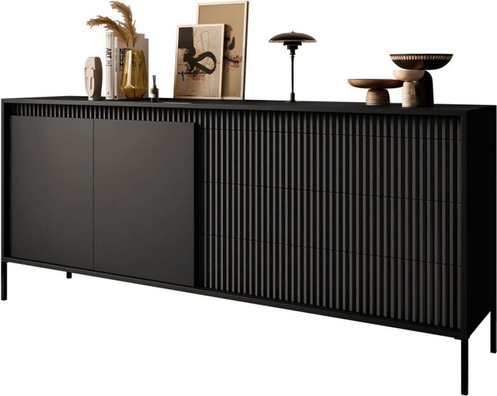 A black sideboard with fluted doors and drawers, decorated with various objects on top.