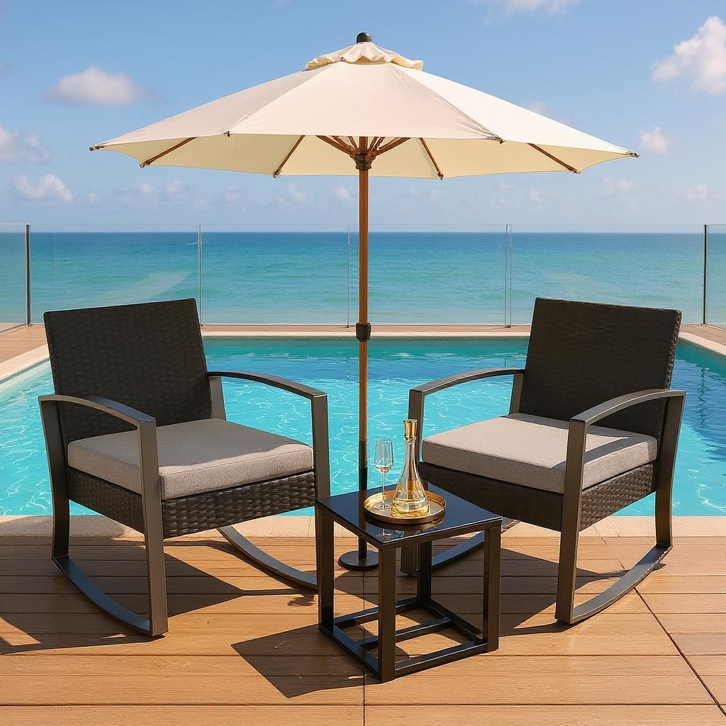 Two rocking chairs and a small table are set up on a wooden deck next to a swimming pool, with an umbrella providing shade.