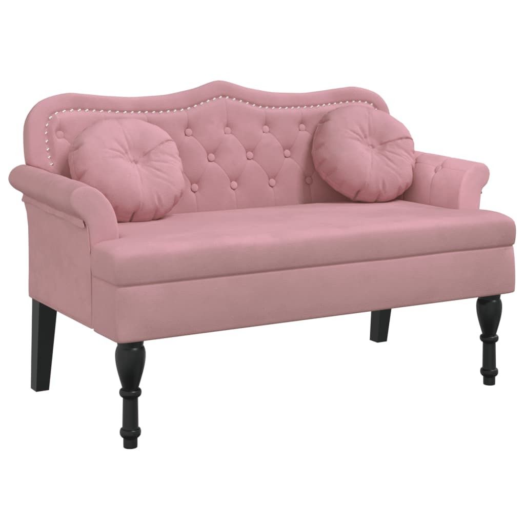A pink velvet loveseat with tufted back and two round cushions, shown against a white background.
