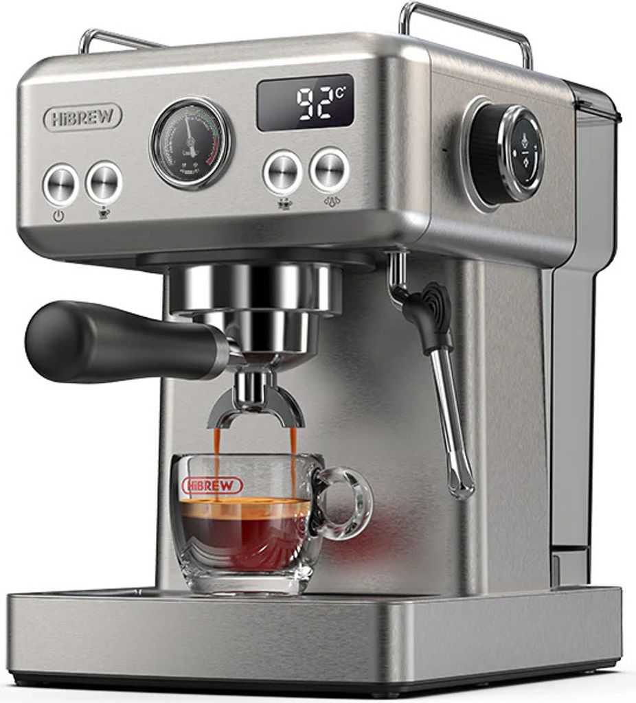 A silver espresso machine is brewing coffee into a clear glass cup.