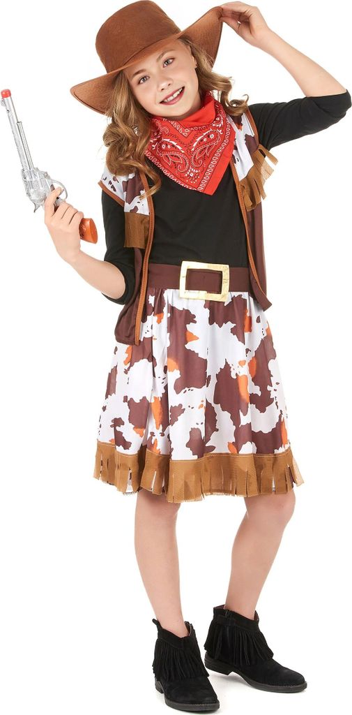A young girl dressed in a cowgirl costume, holding a toy gun.