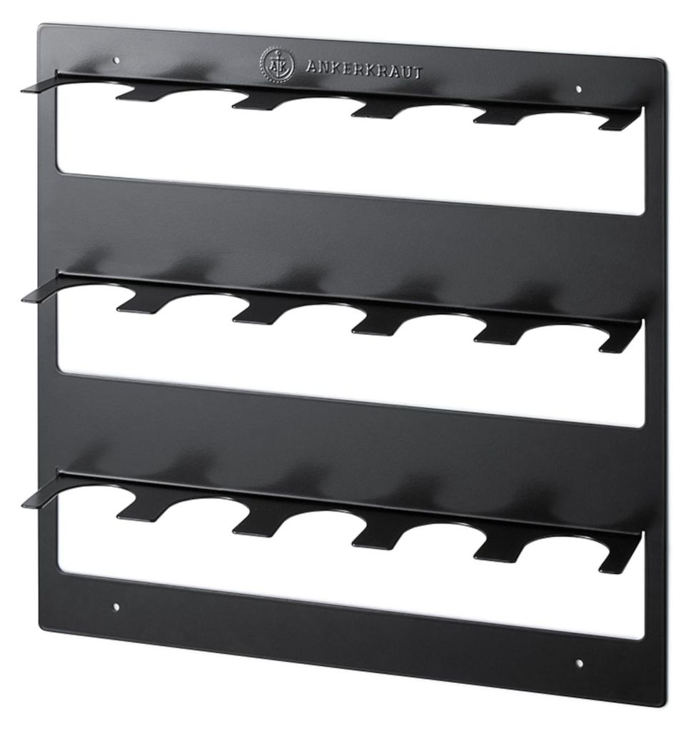 A black metal spice rack with multiple shelves and holders for spice jars.