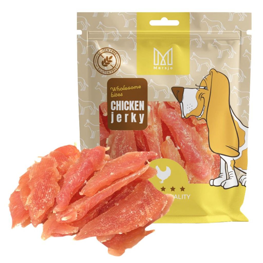 A bag of chicken jerky dog treats with some treats spilled in front of it.