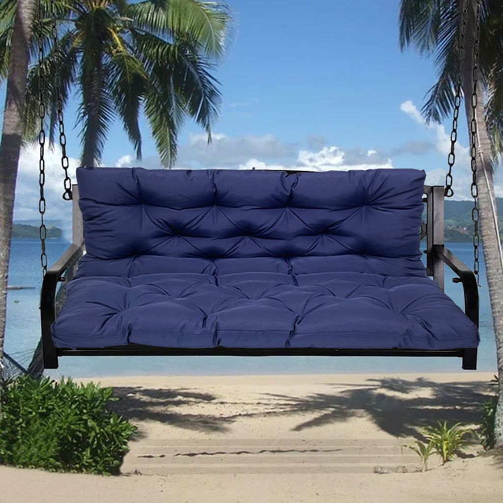 A dark blue swing cushion is shown on a swing set, with palm trees and a beach scene in the background.
