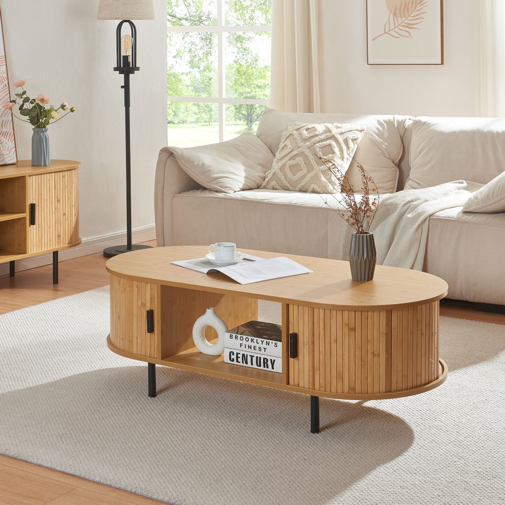 A living room scene featuring a coffee table in front of a couch.