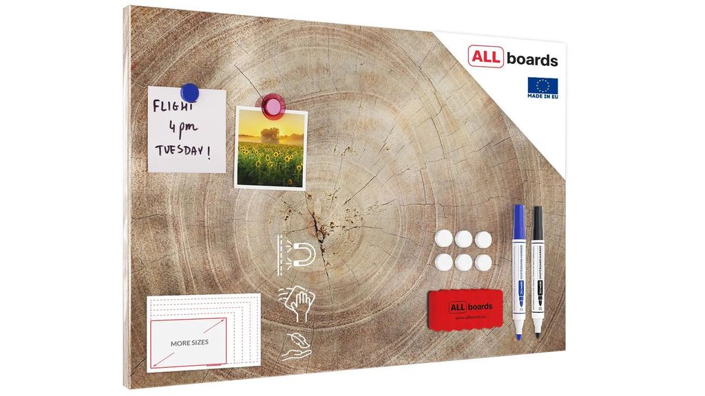 A metallic magnetic board with a wood grain pattern, featuring attached notes, photos, magnets, markers, and a sponge.
