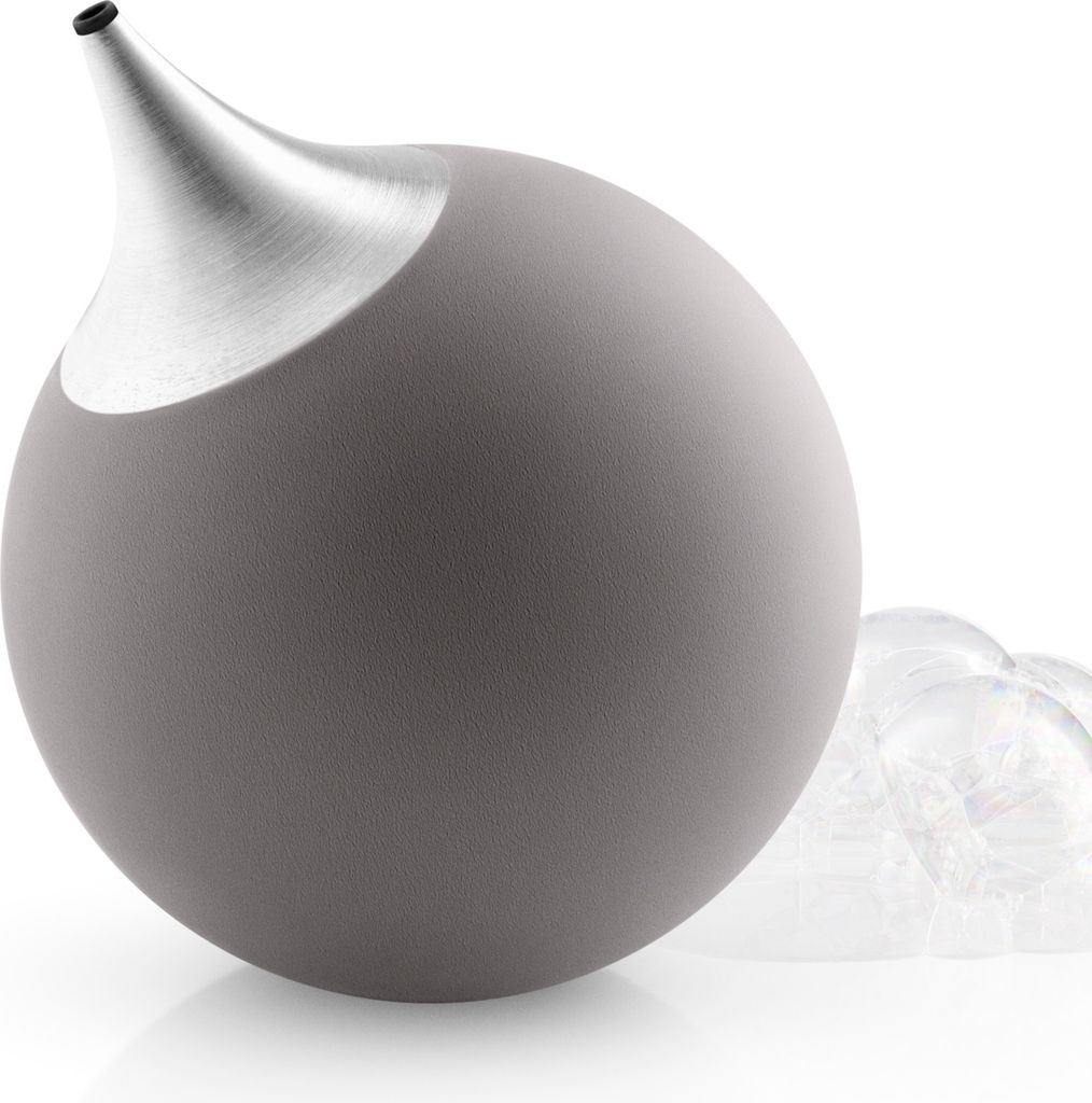A close-up shot of a gray soap dispenser with a silver nozzle, with bubbles to the right.
