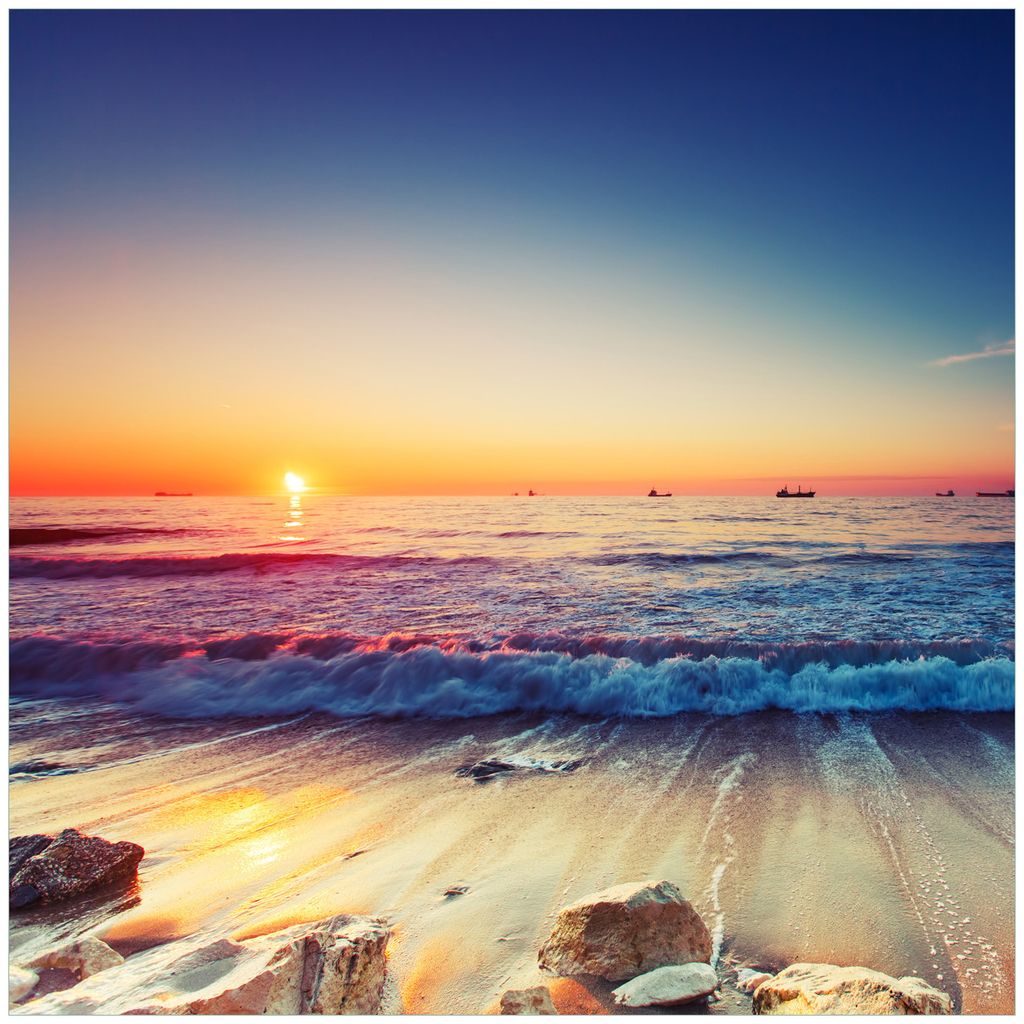 Wallario Wandbild aus Acryl, 50 x 50 cm, freischwebende Optik - Sonnenuntergang am Meer mit Wellen am Strand