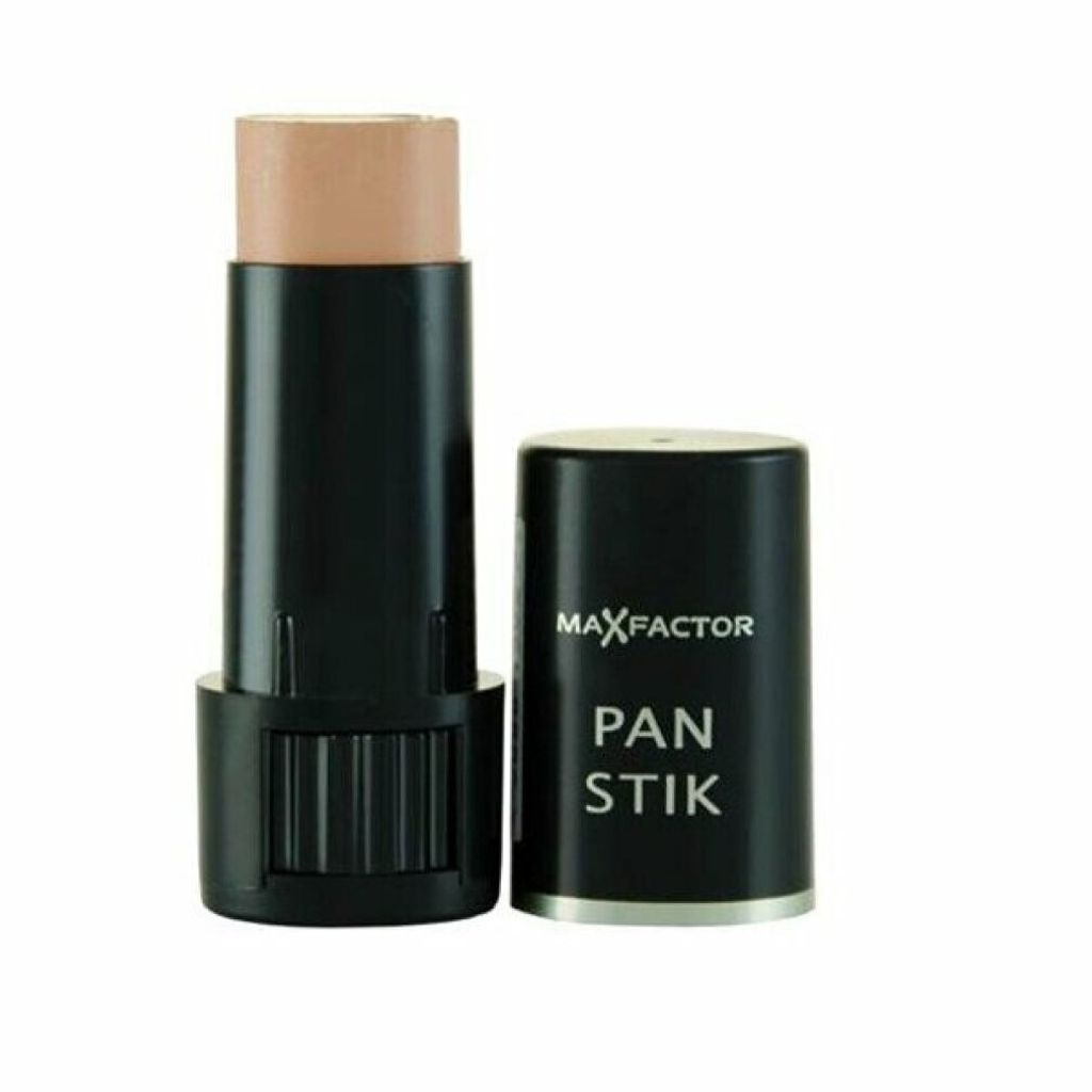A Max Factor Pan Stick makeup product is shown against a white background. The cap is off and placed next to the stick.