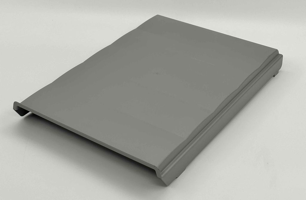 A gray lid for a trash can is shown on a light gray background.