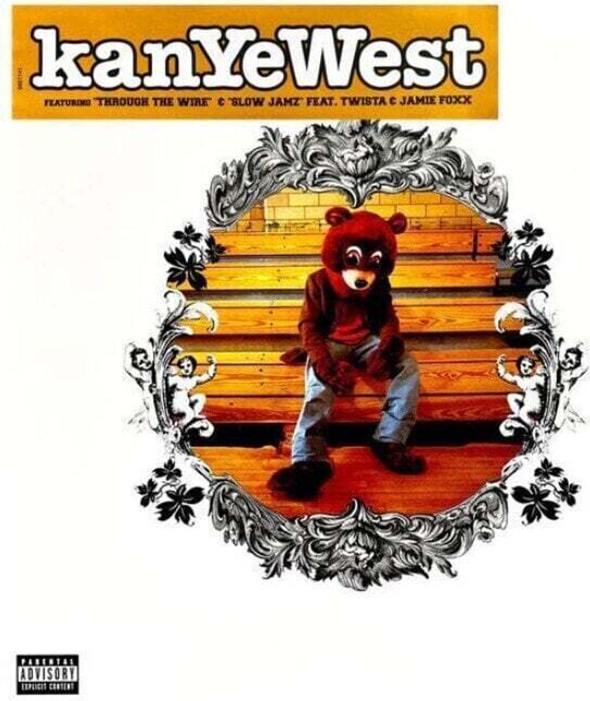 Kanye West sitting on bleachers wearing a bear costume.