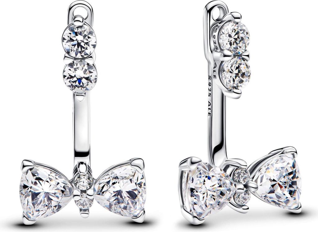 A pair of silver earrings with clear gemstones shaped like bows.