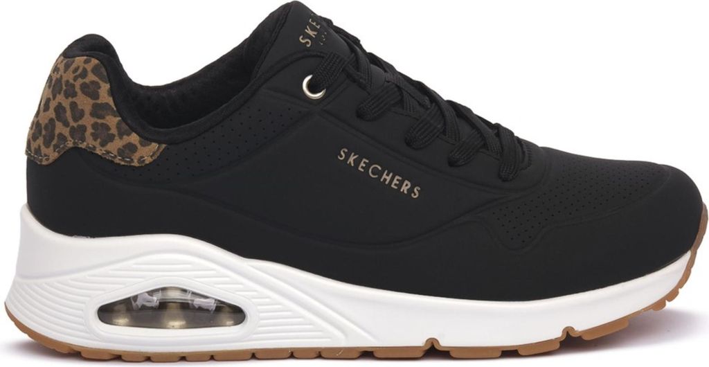 A side view of a black Skechers sneaker with leopard print accents.
