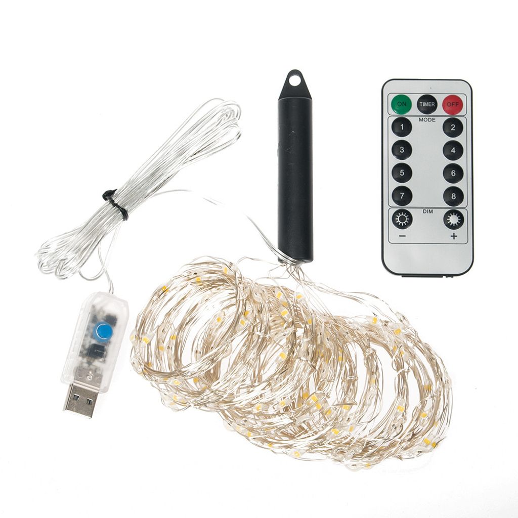 A collection of LED string lights with a USB connector, a battery pack, and a remote control, laid out on a white background.