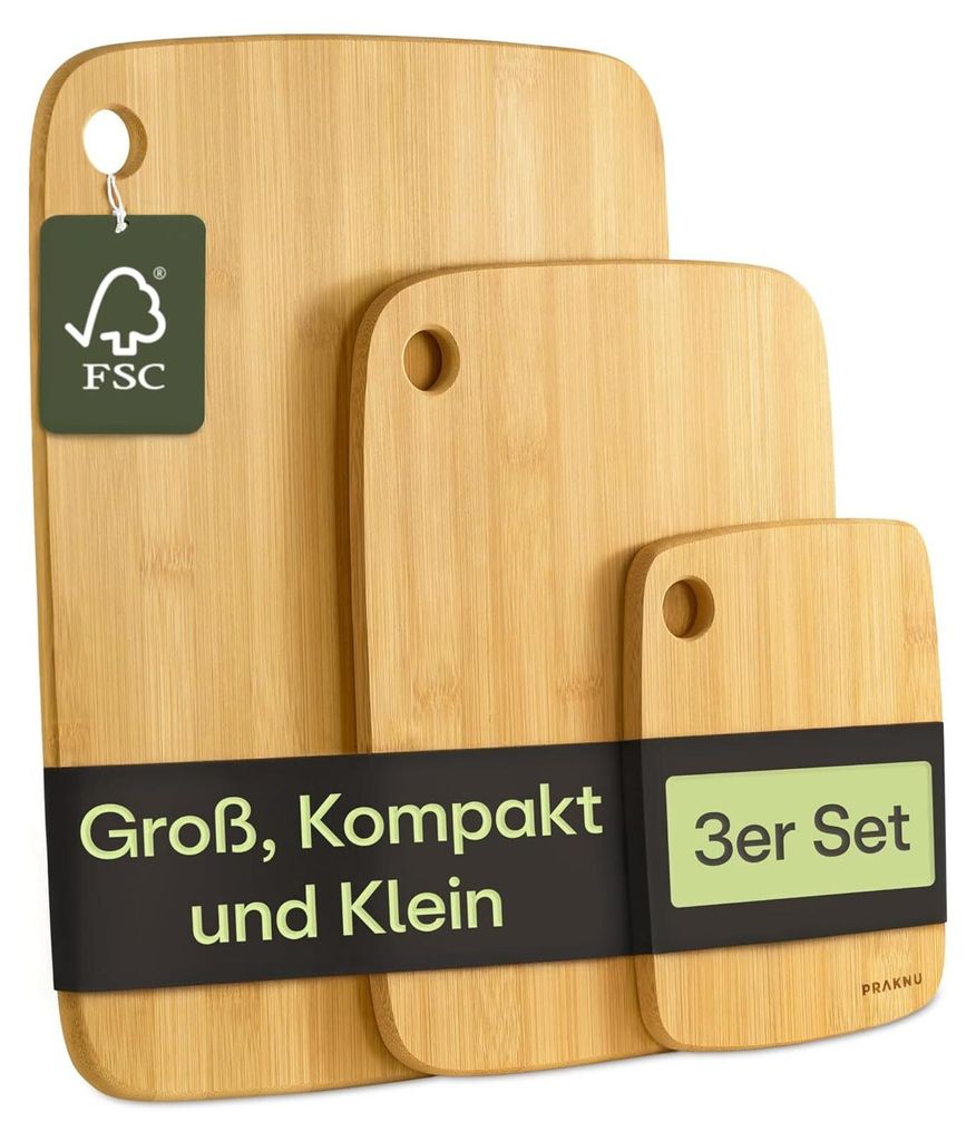 Three bamboo cutting boards of different sizes are displayed against a white background.