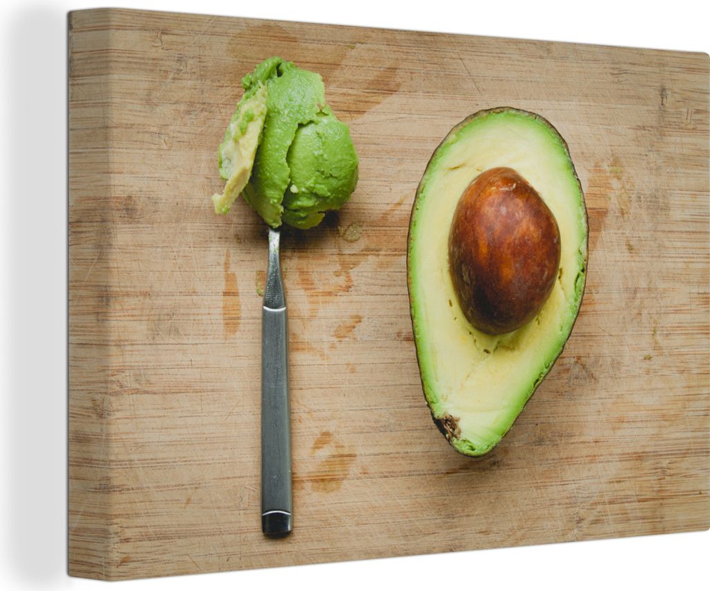 OneMillionCanvasses - Leinwandbilder - 150x100 cm, Avocado auf einem Schneidebrett mit einem Löffel, Wandbilder Kunstdruck Wanddekoration