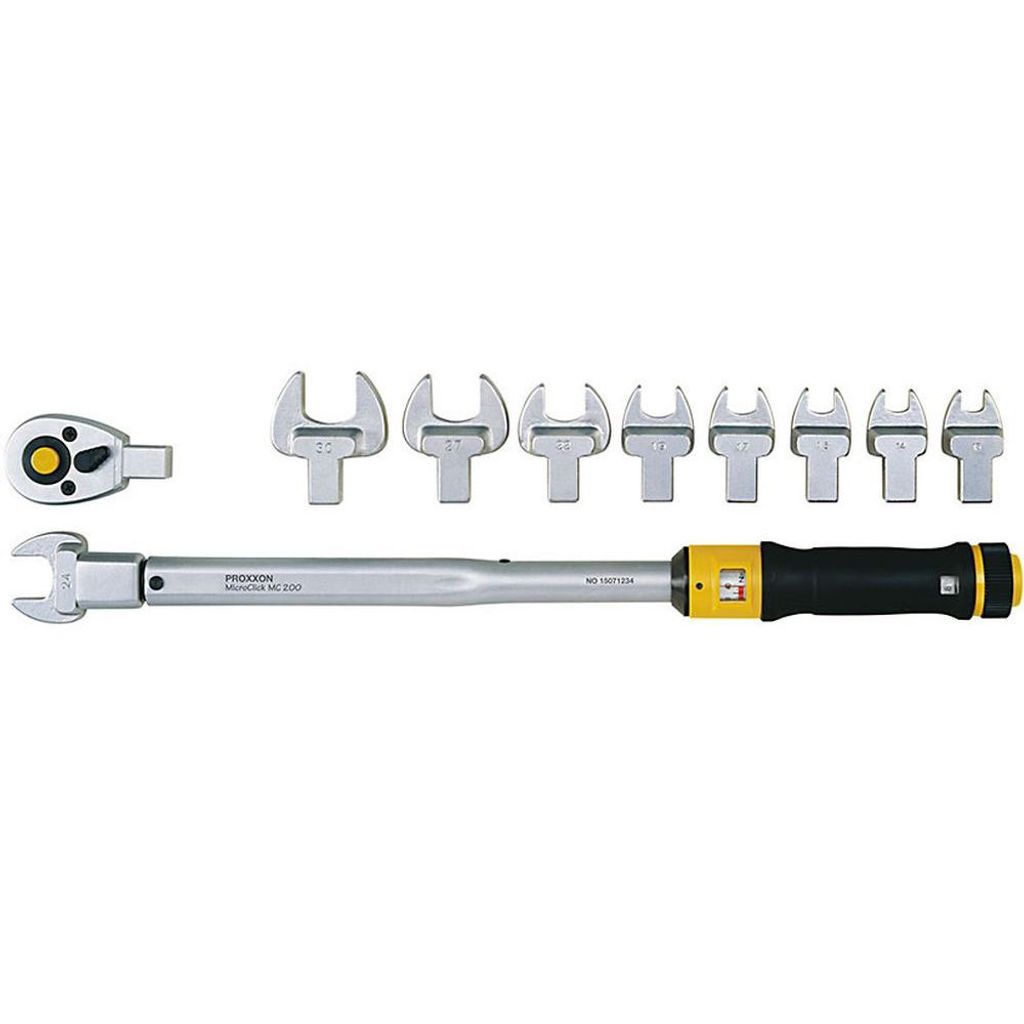 A set of torque wrenches and attachments laid out on a white background.