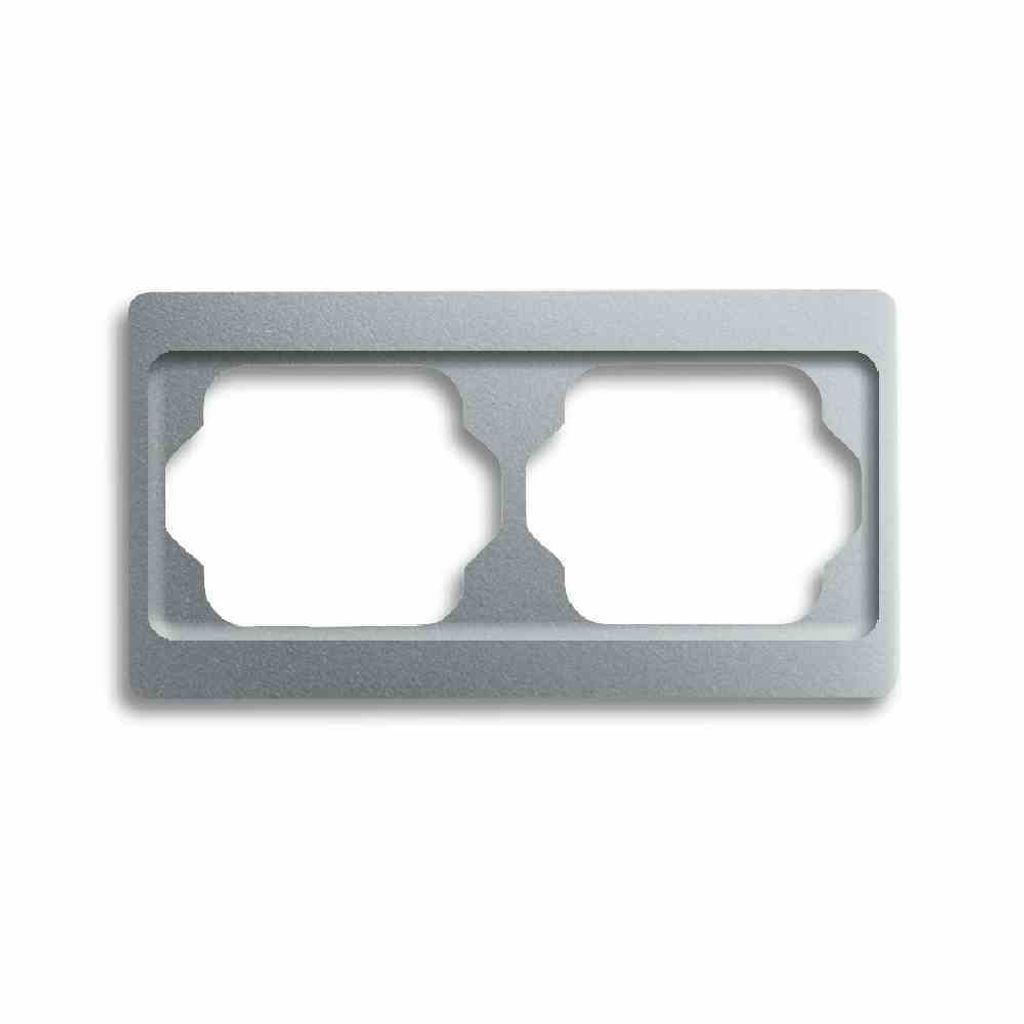 A close-up, studio shot of a gray electrical outlet frame with two openings.