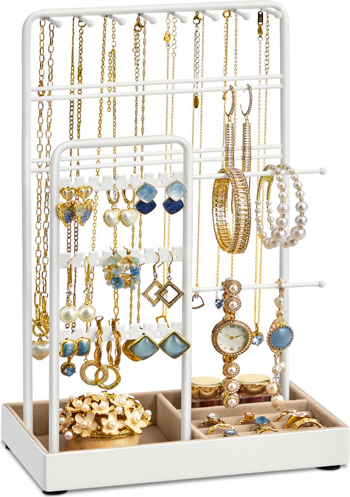 A white jewelry stand filled with various necklaces, earrings, bracelets, and a watch.