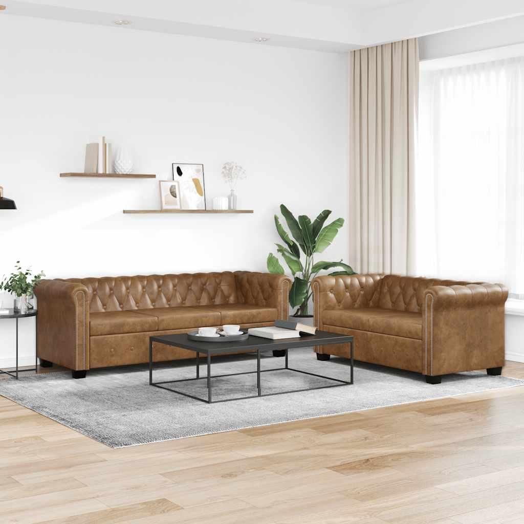 A living room scene with two Chesterfield sofas and a coffee table.