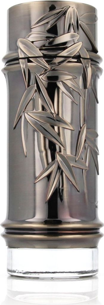 A close-up studio shot of a perfume bottle with a decorative bamboo design.